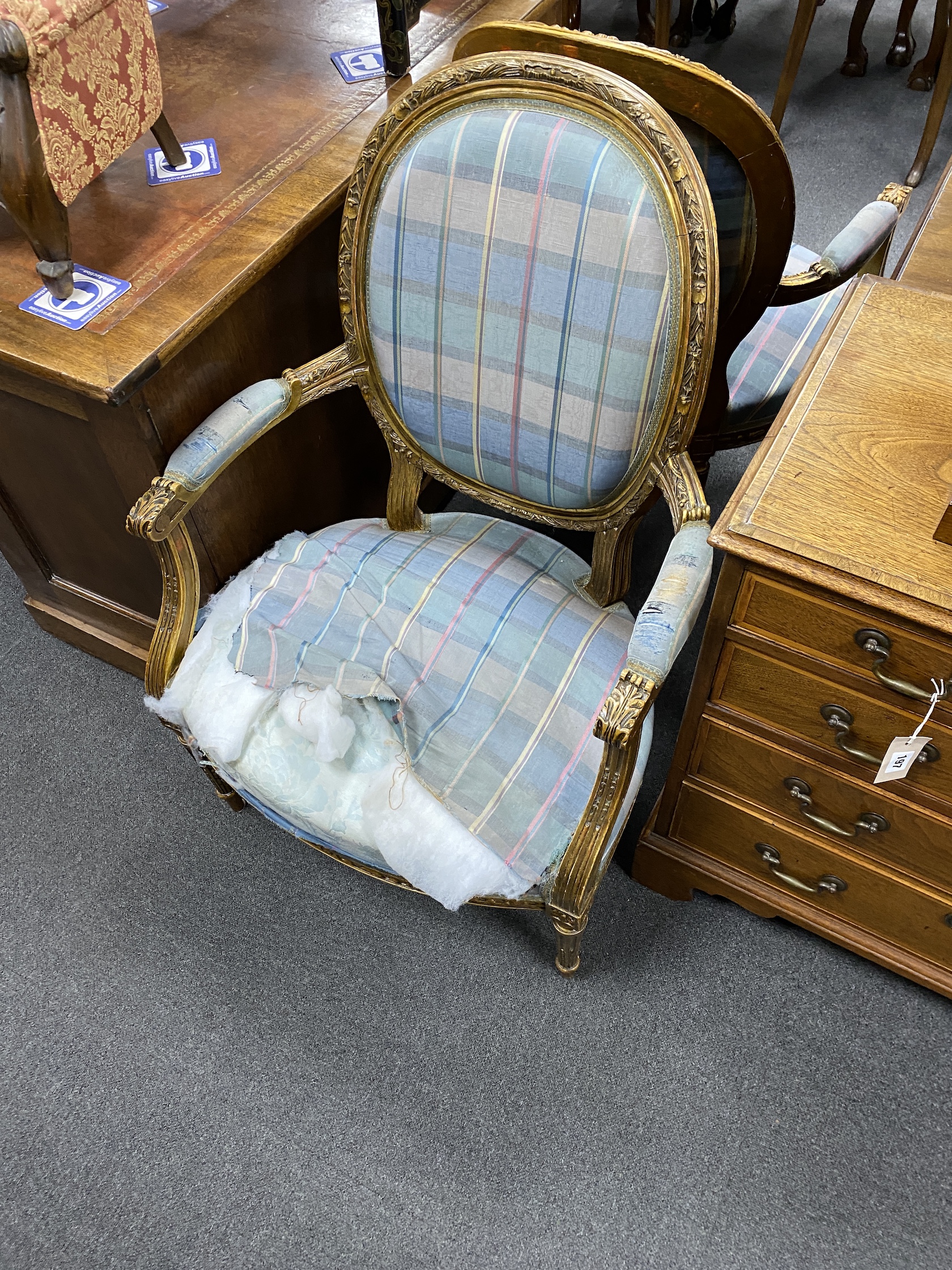 A set of four Louis XVI style giltwood and composition fauteuil, width 64cm, depth 54cm, height 107cm